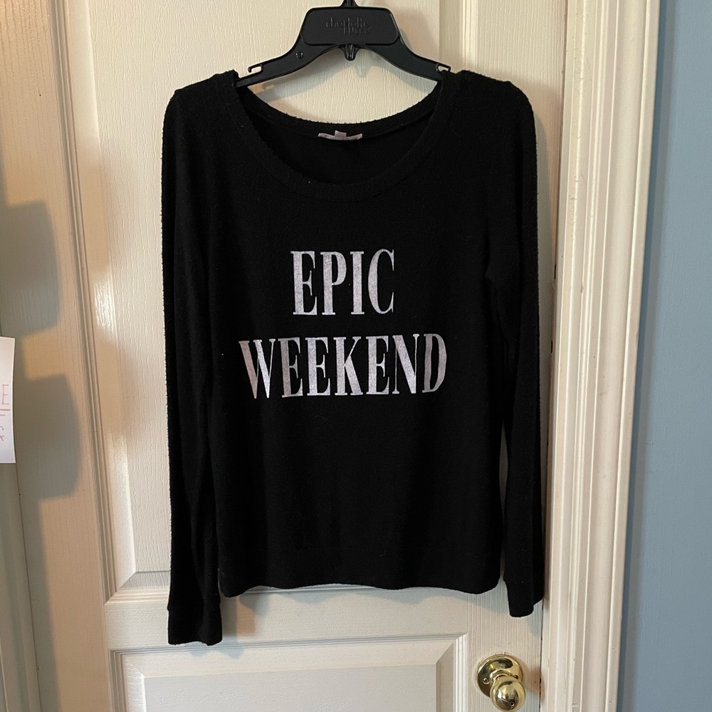 Black sweater says “Epic Weekend”
